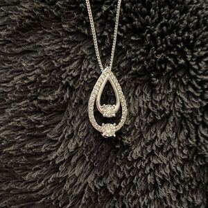 Diamond Pendent, Double teardrop. Diamonds, surrounded by Diamonds
10kt Pendent
